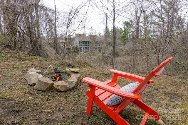 view of yard with an outdoor fire pit