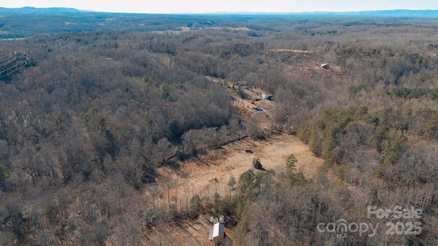 bird's eye view featuring a mountain view and a forest view