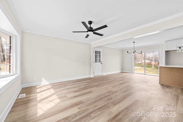 unfurnished living room featuring visible vents, crown molding, light wood-type flooring, and baseboards