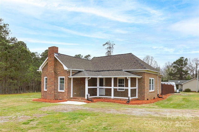 2005 Douglas Rd, Lancaster, SC 28720 - view of front of property featuring brick siding, covered porch, a front lawn, and roof with shingles