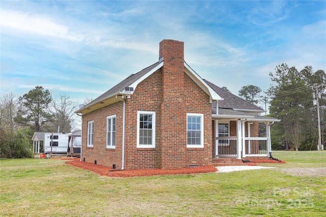 2005 Douglas Rd, Lancaster, SC 28720 - exterior space featuring brick siding, a shingled roof, a lawn, a chimney, and crawl space