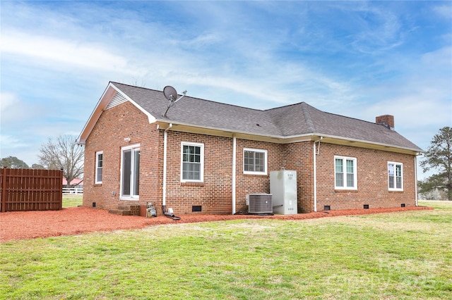 2005 Douglas Rd, Lancaster, SC 28720 - rear view of property with cooling unit, a chimney, a yard, and crawl space