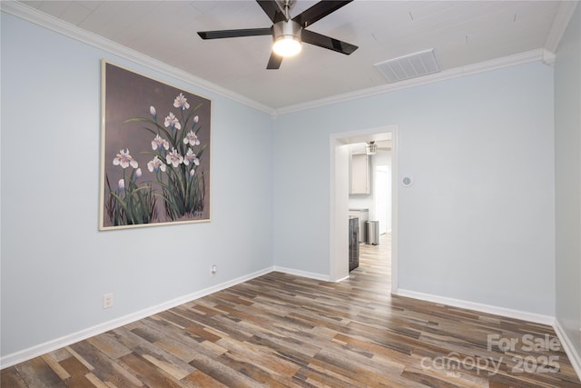 2005 Douglas Rd, Lancaster, SC 28720 - spare room featuring ornamental molding, wood finished floors, visible vents, and ceiling fan