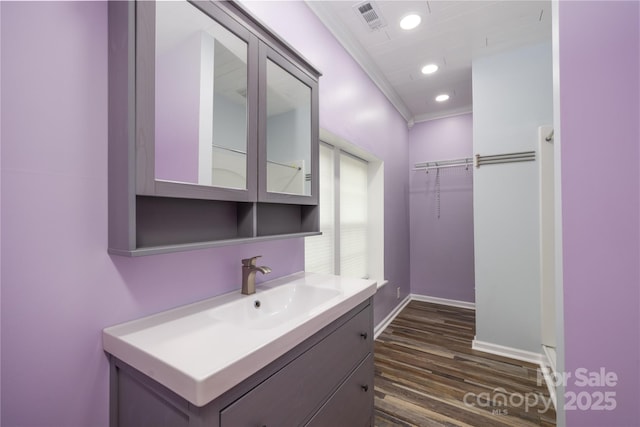 2005 Douglas Rd, Lancaster, SC 28720 - bathroom featuring vanity, wood finished floors, visible vents, baseboards, and recessed lighting