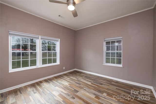 2005 Douglas Rd, Lancaster, SC 28720 - unfurnished room with ornamental molding, baseboards, a ceiling fan, and wood finished floors