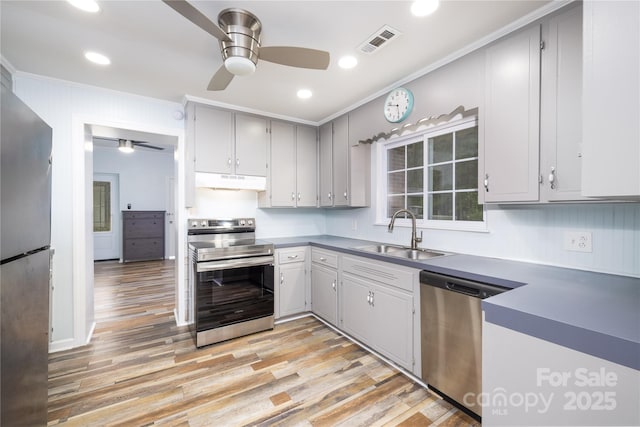 2005 Douglas Rd, Lancaster, SC 28720 - kitchen featuring under cabinet range hood, visible vents, appliances with stainless steel finishes, and a ceiling fan