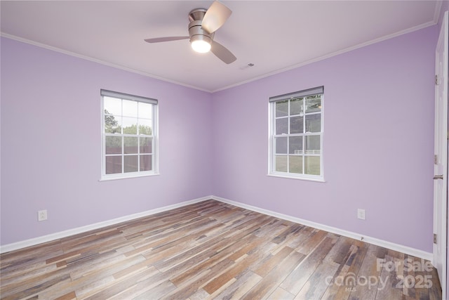 2005 Douglas Rd, Lancaster, SC 28720 - unfurnished room featuring crown molding, wood finished floors, visible vents, and ceiling fan