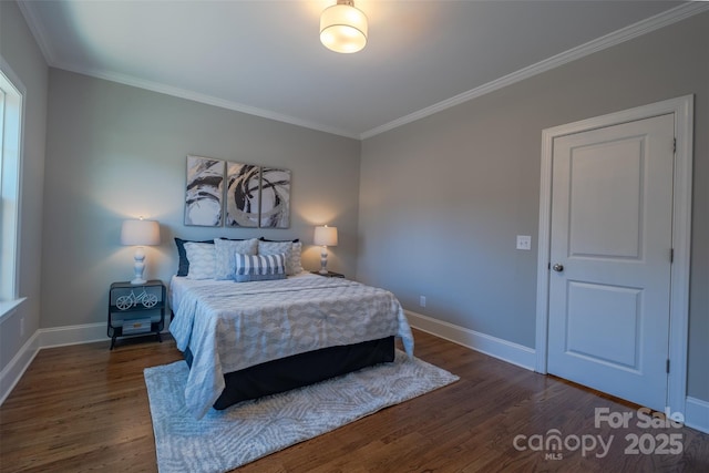 bedroom with baseboards, dark wood-style flooring, and ornamental molding