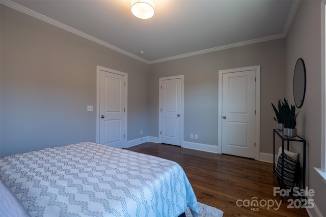 bedroom with baseboards, ornamental molding, and dark wood-style flooring