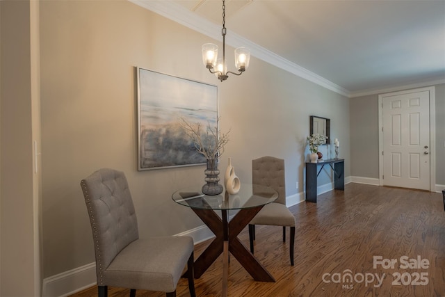 dining room with a chandelier, baseboards, wood finished floors, and ornamental molding