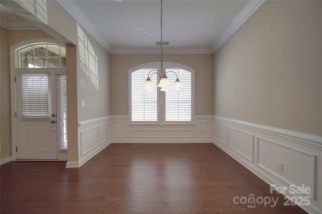 unfurnished dining area featuring a chandelier, visible vents, crown molding, and dark wood-style floors