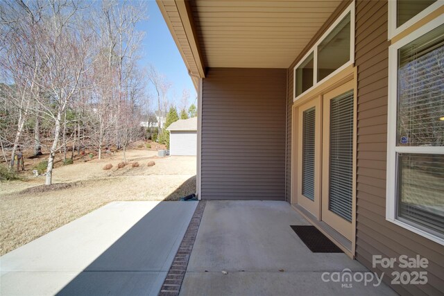 view of patio featuring a detached garage