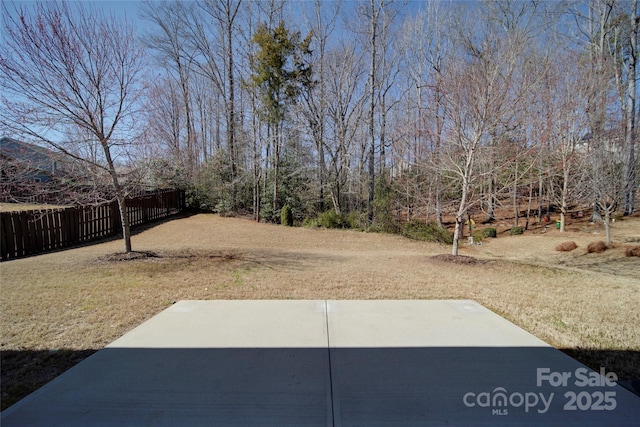 view of yard with a patio and fence