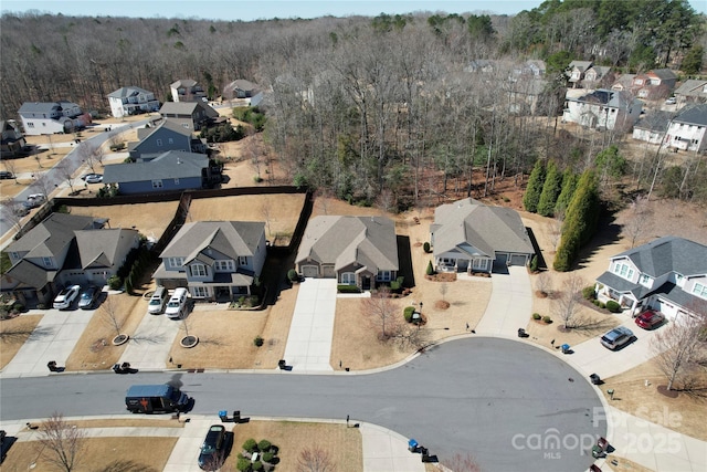 aerial view featuring a residential view and a forest view