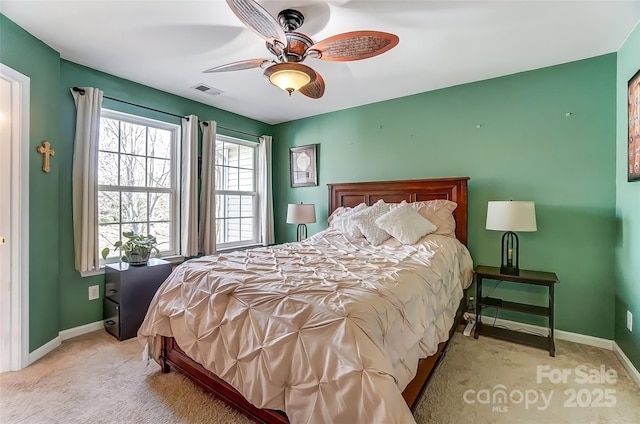 bedroom with a ceiling fan, carpet flooring, baseboards, and visible vents