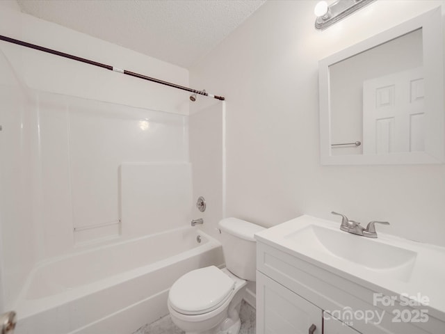 bathroom with toilet, a textured ceiling, vanity, and bathing tub / shower combination