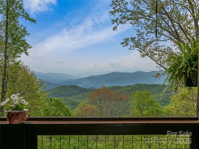 view of mountain feature with a view of trees