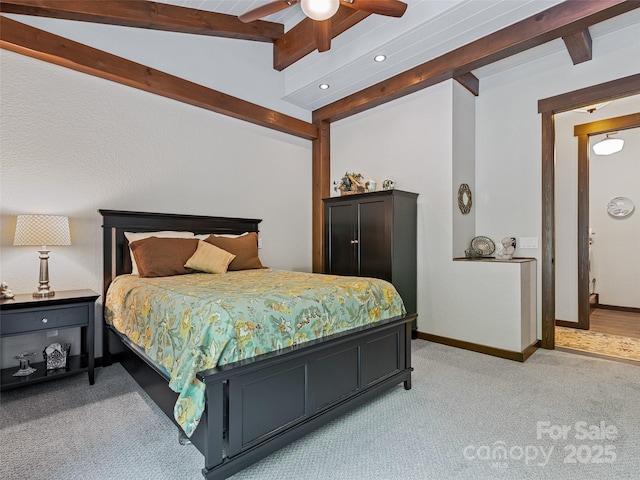 bedroom featuring lofted ceiling with beams, baseboards, light colored carpet, and ceiling fan