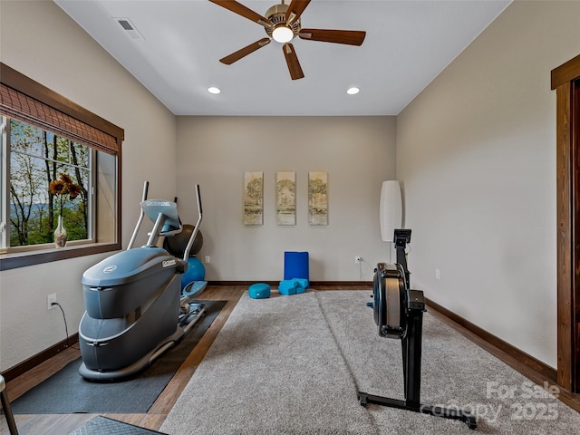 exercise room featuring visible vents, wood finished floors, recessed lighting, baseboards, and ceiling fan