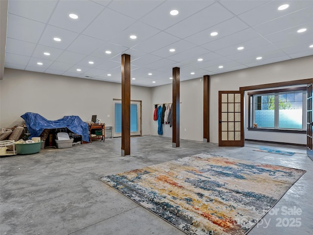 basement with recessed lighting and a drop ceiling