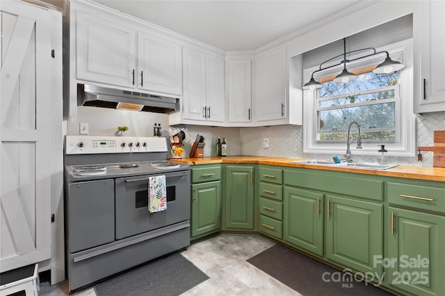 kitchen featuring range with two ovens, a sink, butcher block countertops, under cabinet range hood, and white cabinetry