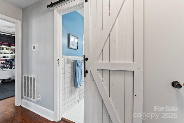 interior space featuring visible vents and wood finished floors