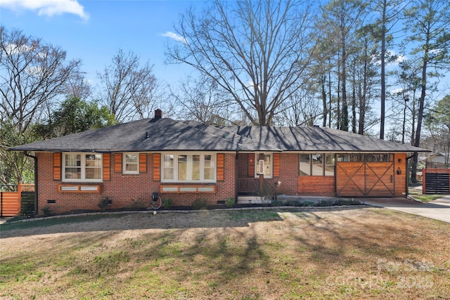 ranch-style house featuring crawl space, driveway, a front yard, and brick siding