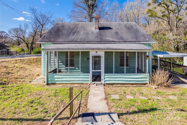 36 Brookline St, Great Falls, SC 29055 - view of front of home featuring a shingled roof, a chimney, and a sunroom