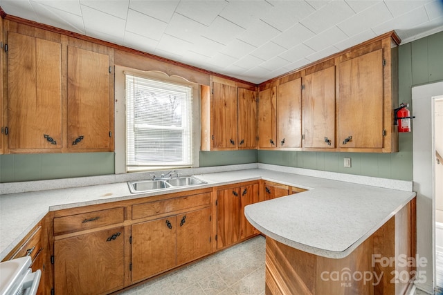 36 Brookline St, Great Falls, SC 29055 - kitchen with brown cabinets, light countertops, and a sink