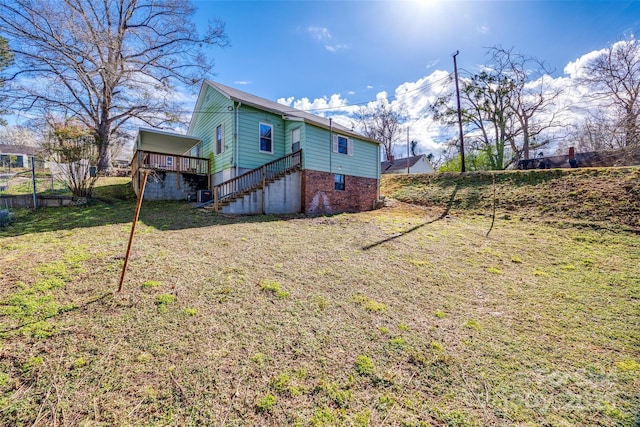 36 Brookline St, Great Falls, SC 29055 - back of house featuring stairway, a yard, a wooden deck, and fence