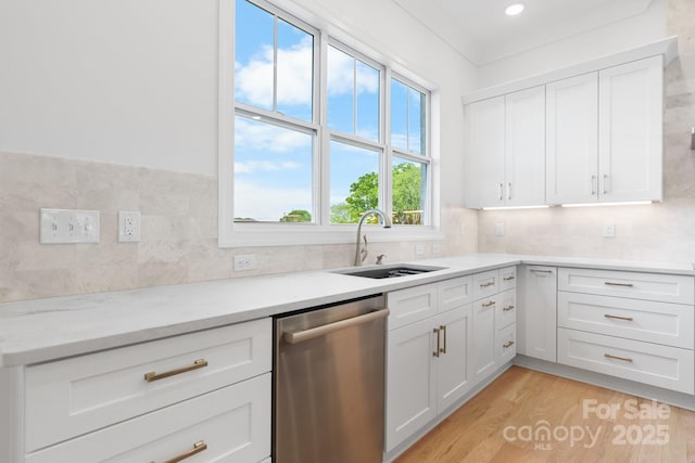 4227 Holly Cir NE, Conover, NC 28613 - kitchen featuring a sink, light wood-style flooring, dishwasher, and white cabinets