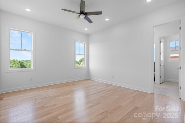 4227 Holly Cir NE, Conover, NC 28613 - unfurnished room with a healthy amount of sunlight, ceiling fan, and light wood-style flooring