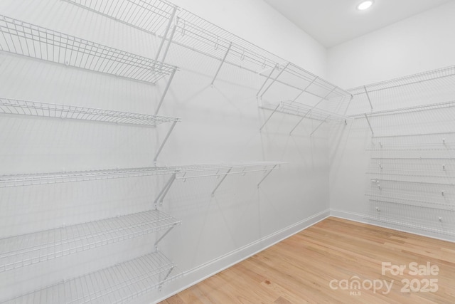 4227 Holly Cir NE, Conover, NC 28613 - walk in closet featuring wood finished floors