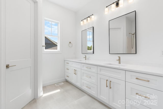 4227 Holly Cir NE, Conover, NC 28613 - full bath featuring a sink, baseboards, double vanity, and visible vents