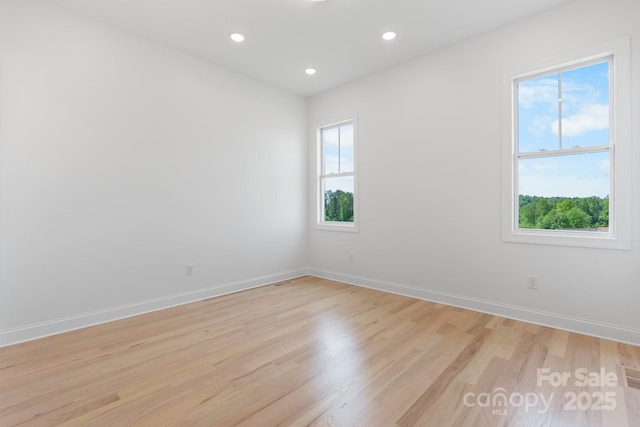 4227 Holly Cir NE, Conover, NC 28613 - empty room with baseboards, recessed lighting, and light wood-type flooring