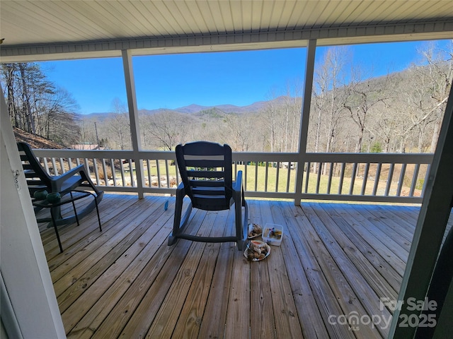 wooden terrace featuring a mountain view