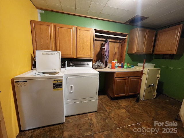 laundry area featuring cabinet space and independent washer and dryer