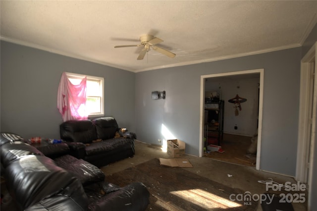 living area with ceiling fan and ornamental molding