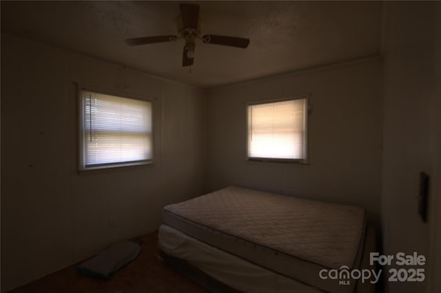 bedroom featuring ceiling fan