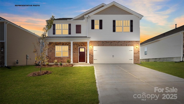 view of front of property featuring driveway, brick siding, an attached garage, and a front yard