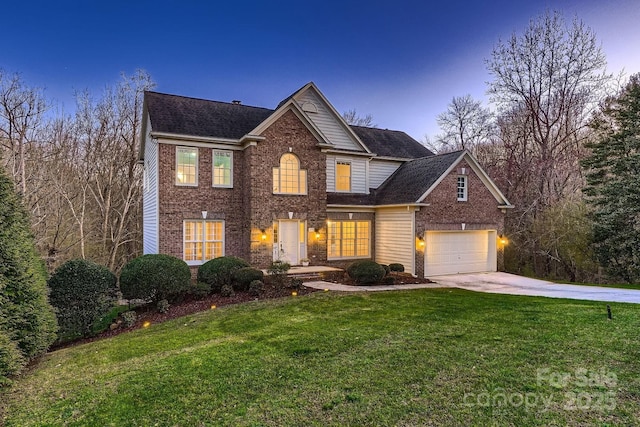 traditional-style house featuring brick siding, a lawn, concrete driveway, and a garage