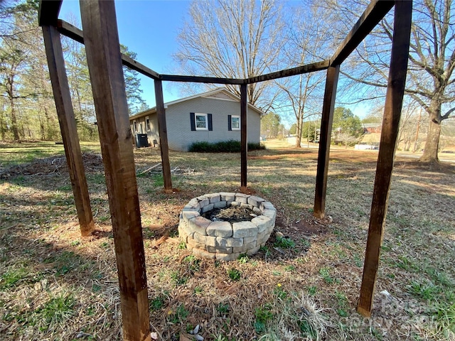 view of yard with an outdoor fire pit