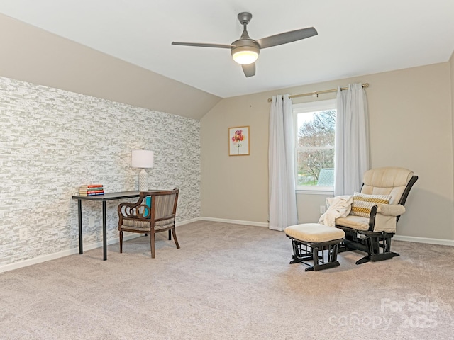 office space featuring carpet flooring, a ceiling fan, baseboards, and vaulted ceiling