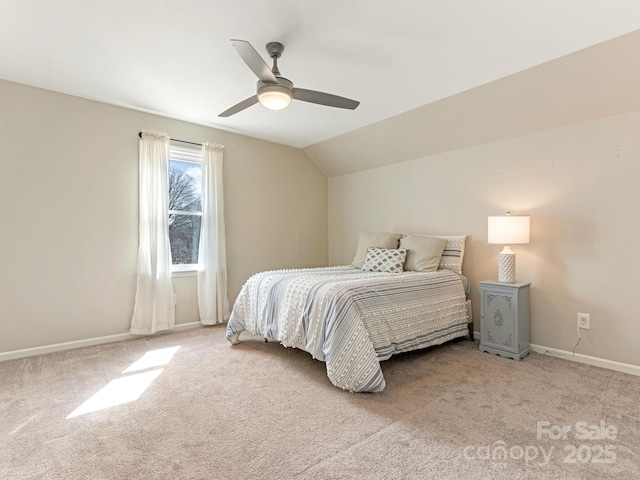 bedroom featuring vaulted ceiling, carpet, baseboards, and ceiling fan