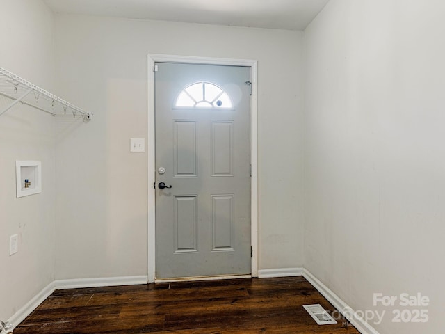 interior space featuring visible vents, laundry area, baseboards, hookup for a washing machine, and dark wood-style flooring