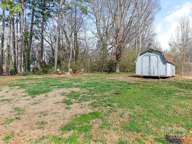 view of yard with an outbuilding and a storage shed