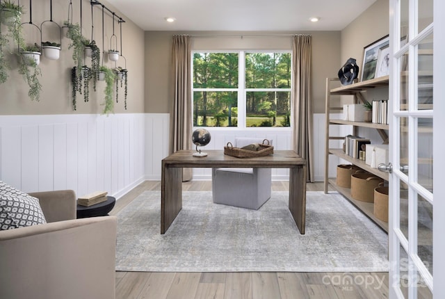 office with light wood-style flooring, recessed lighting, and a wainscoted wall