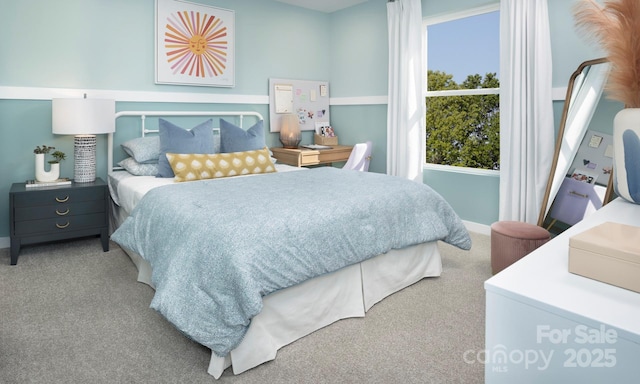 bedroom featuring carpet flooring and baseboards