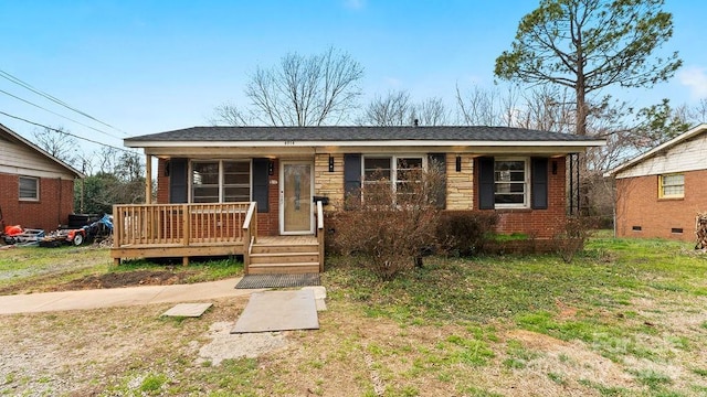 view of front of home featuring covered porch and brick siding