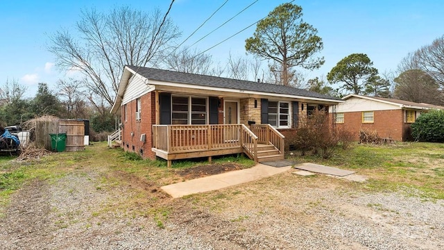 view of front of property with a porch and brick siding